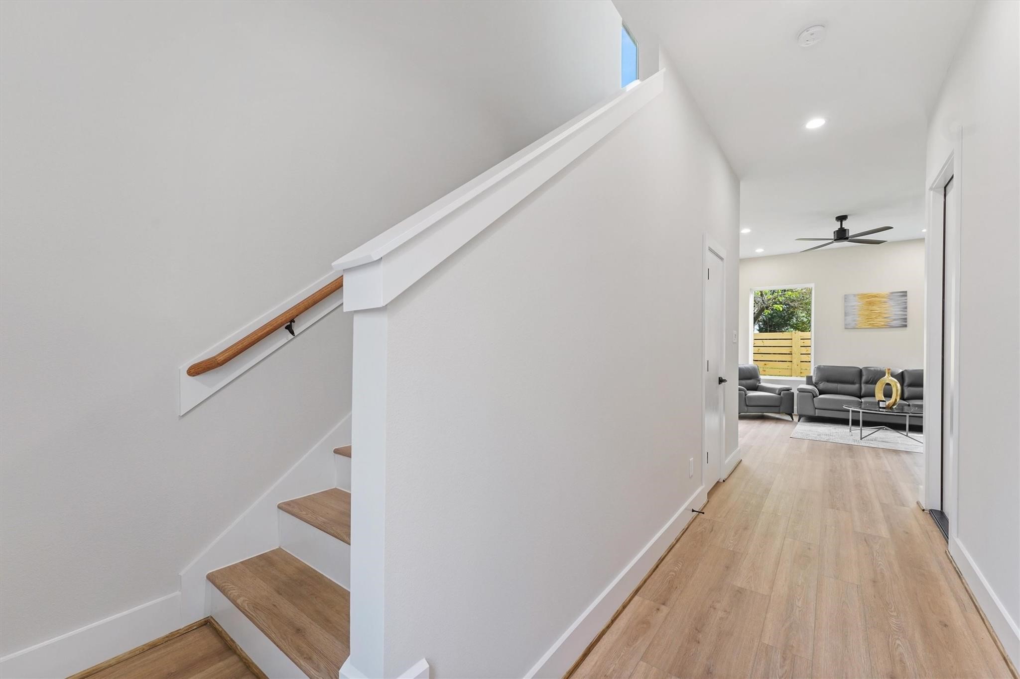 2131 Blalock Road, Unit G Houston, TX 77080 - Photo 11 of 28 a view of a hallway with wooden floor and staircase