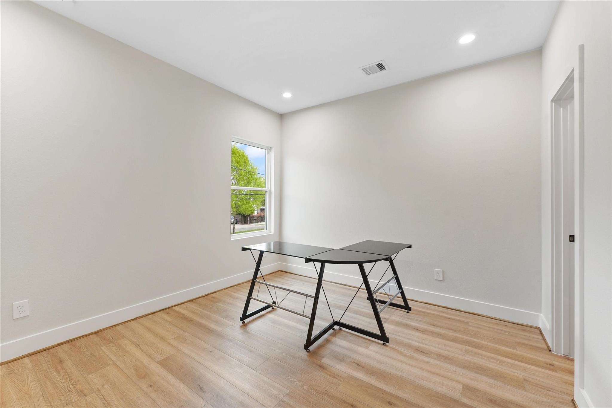 2131 Blalock Road, Unit G Houston, TX 77080 - Photo 20 of 28 a view of wooden floor and windows in a room