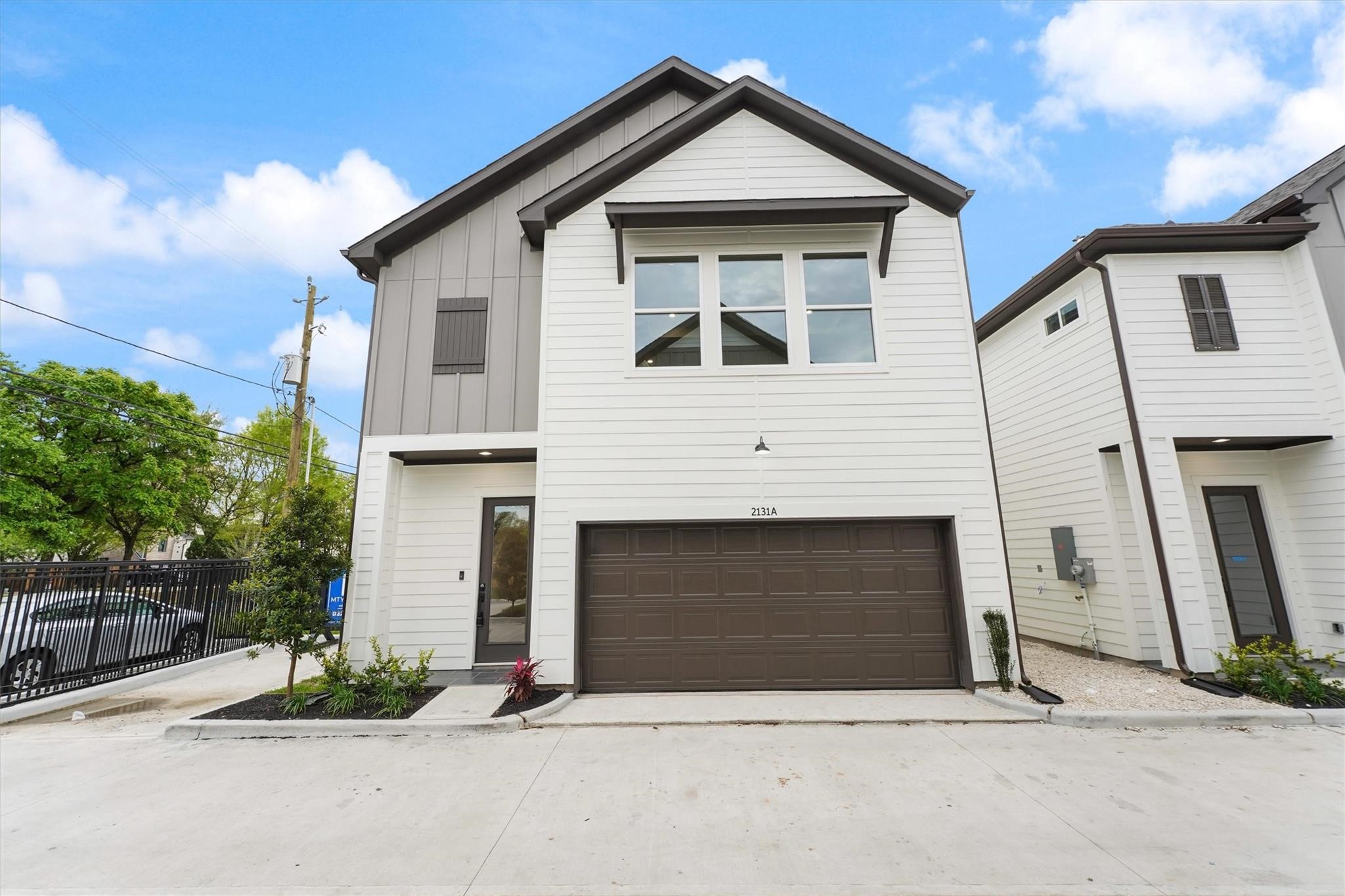 2131 Blalock Road, Unit G Houston, TX 77080 - Photo 2 of 28 a front view of a house with garage