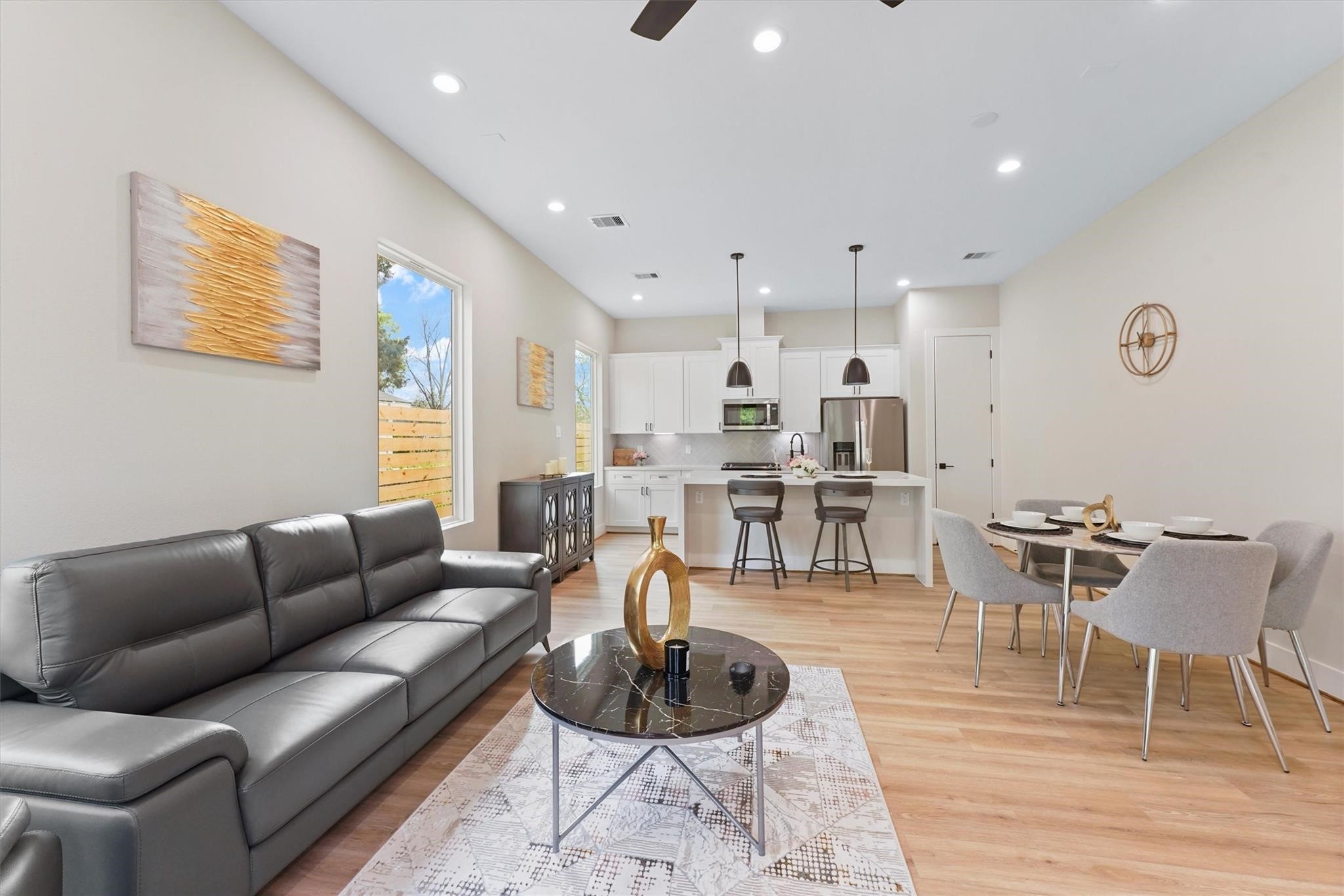 2131 Blalock Road, Unit G Houston, TX 77080 - Photo 5 of 28 a living room with furniture and a wooden floor