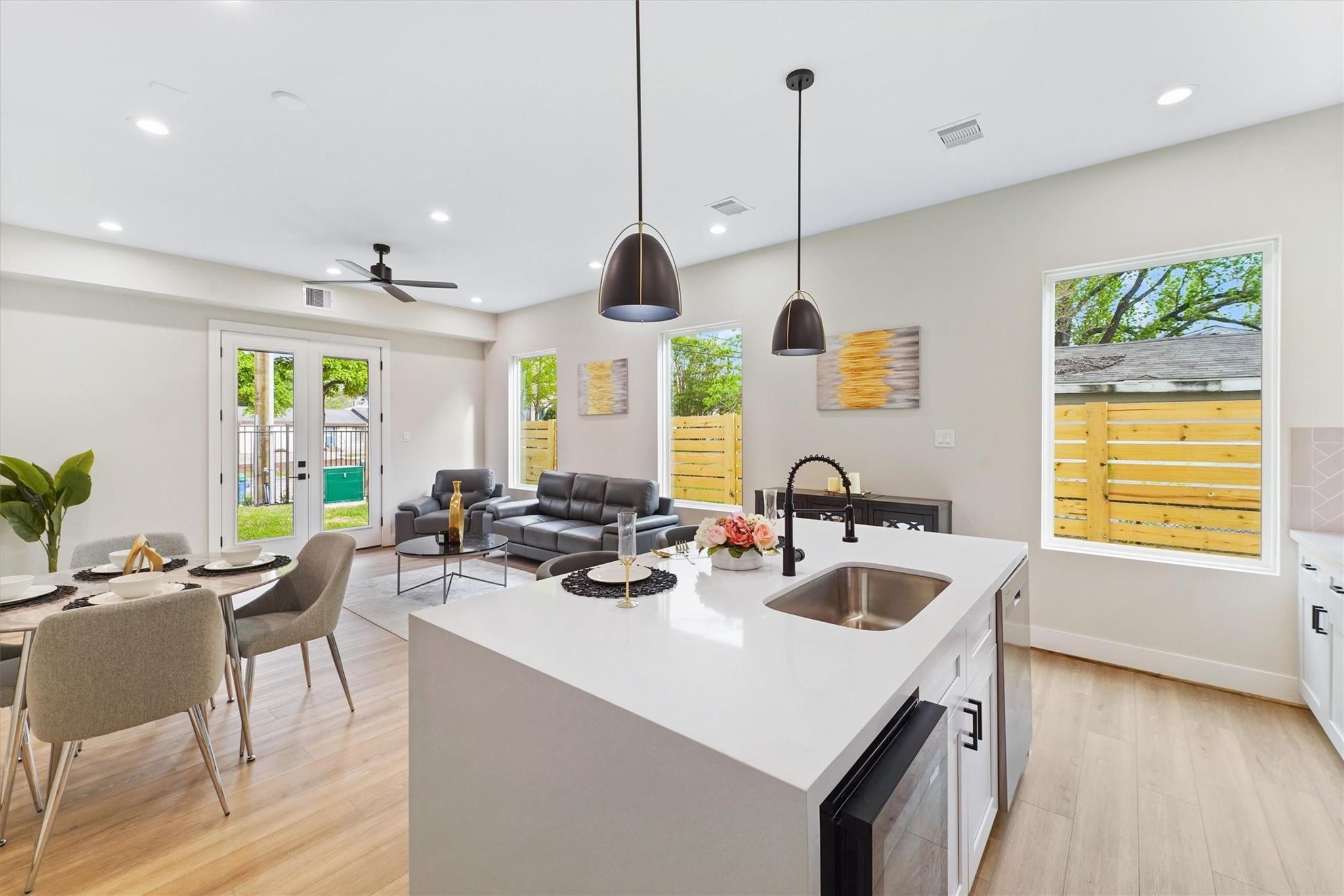 2131 Blalock Road, Unit G Houston, TX 77080 - Photo 6 of 28 a kitchen with sink a oven and chairs