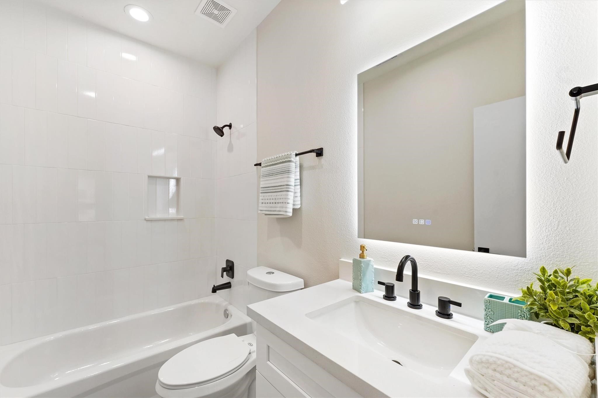 2131 Blalock Road, Unit G Houston, TX 77080 - Photo 10 of 28 a bathroom with a sink toilet and shower