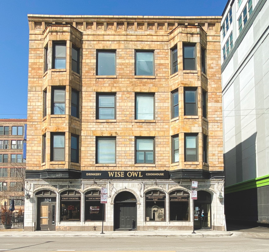 a front view of a building with glass windows
