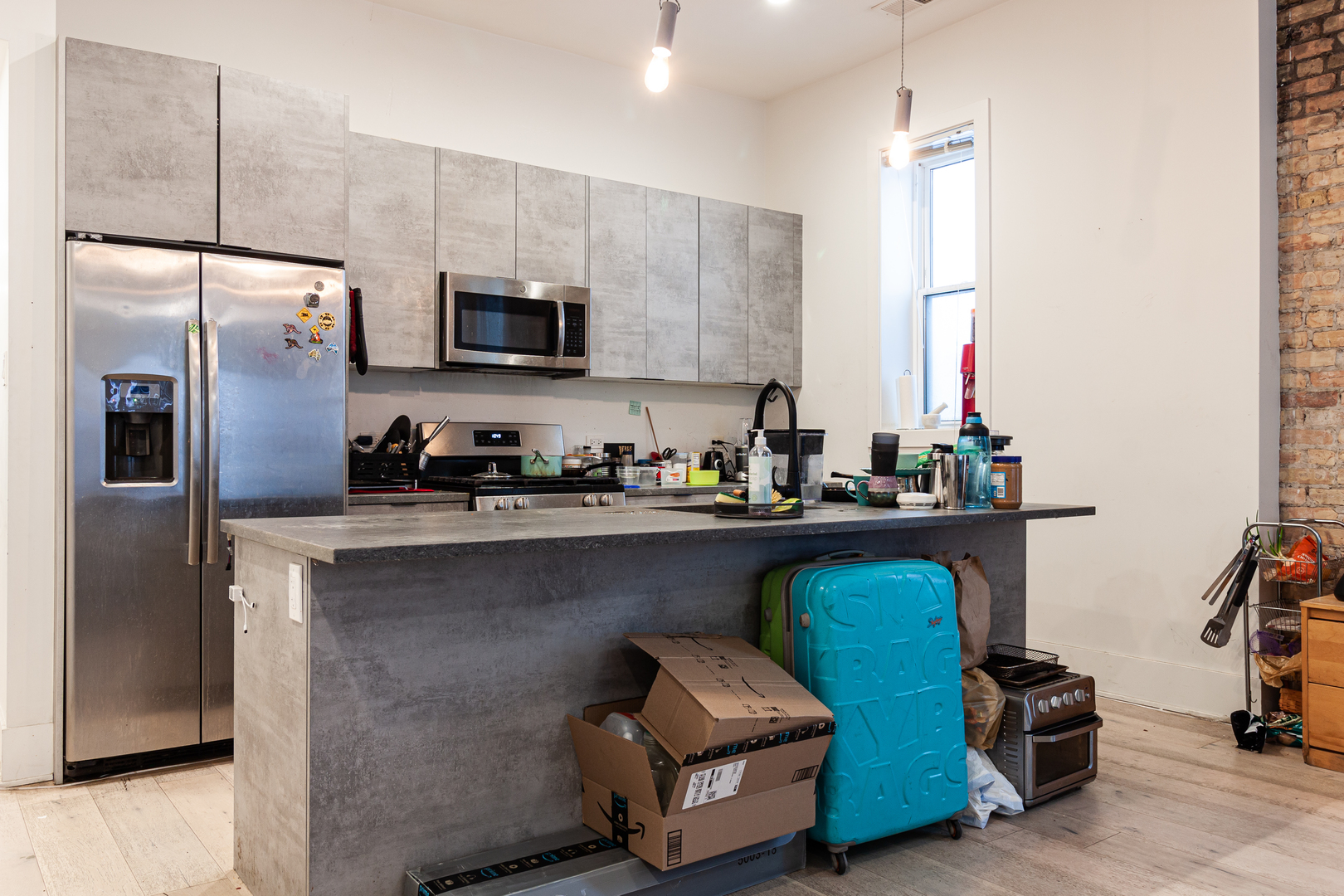 324 South Racine Avenue, Unit 4N Chicago, IL 60607 - Photo 2 of 9 a kitchen with stainless steel appliances a refrigerator a sink a stove and cabinets