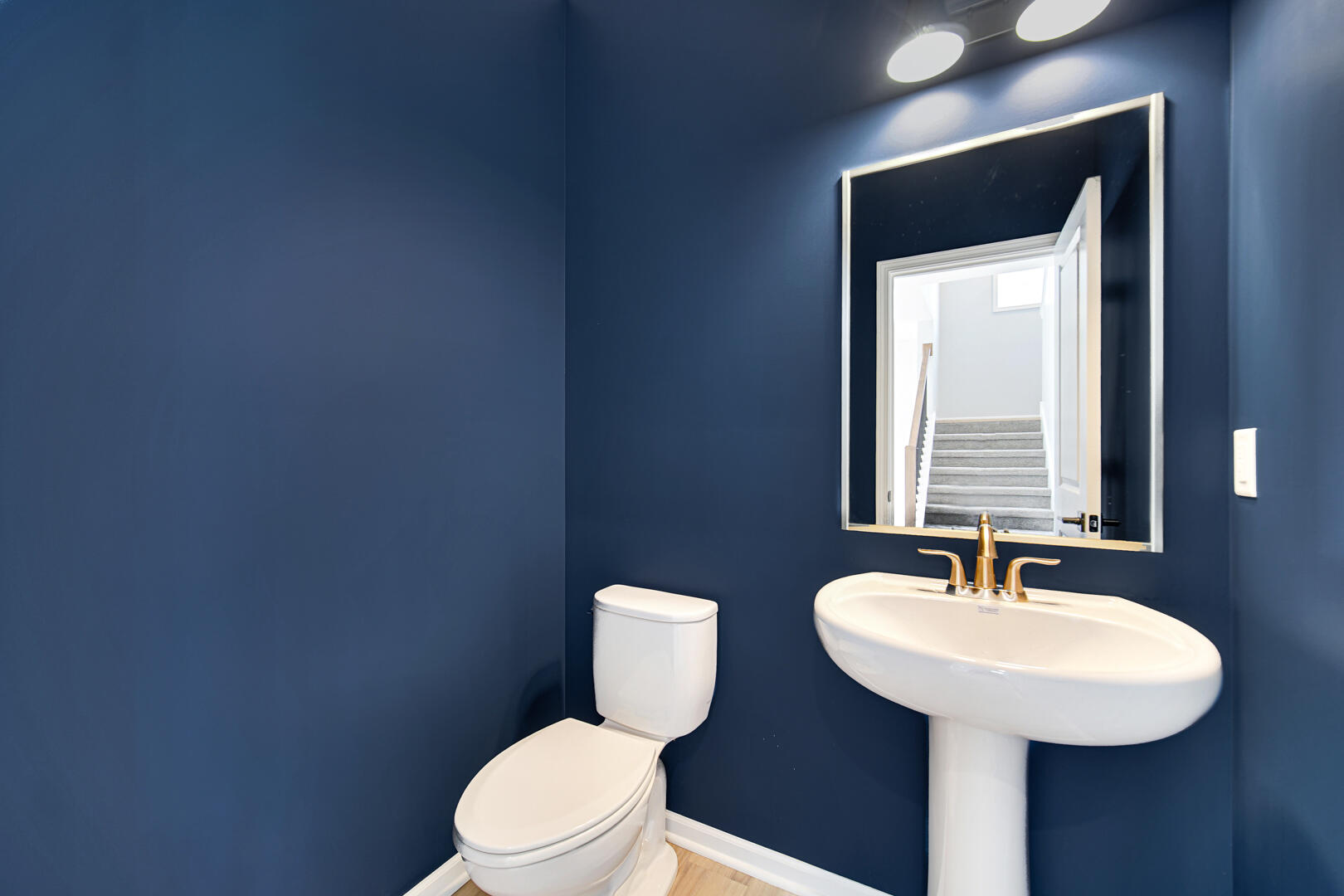 708 Druim Trail Crown Point, IN 46307 - Photo 12 of 27 a bathroom with a toilet sink and mirror