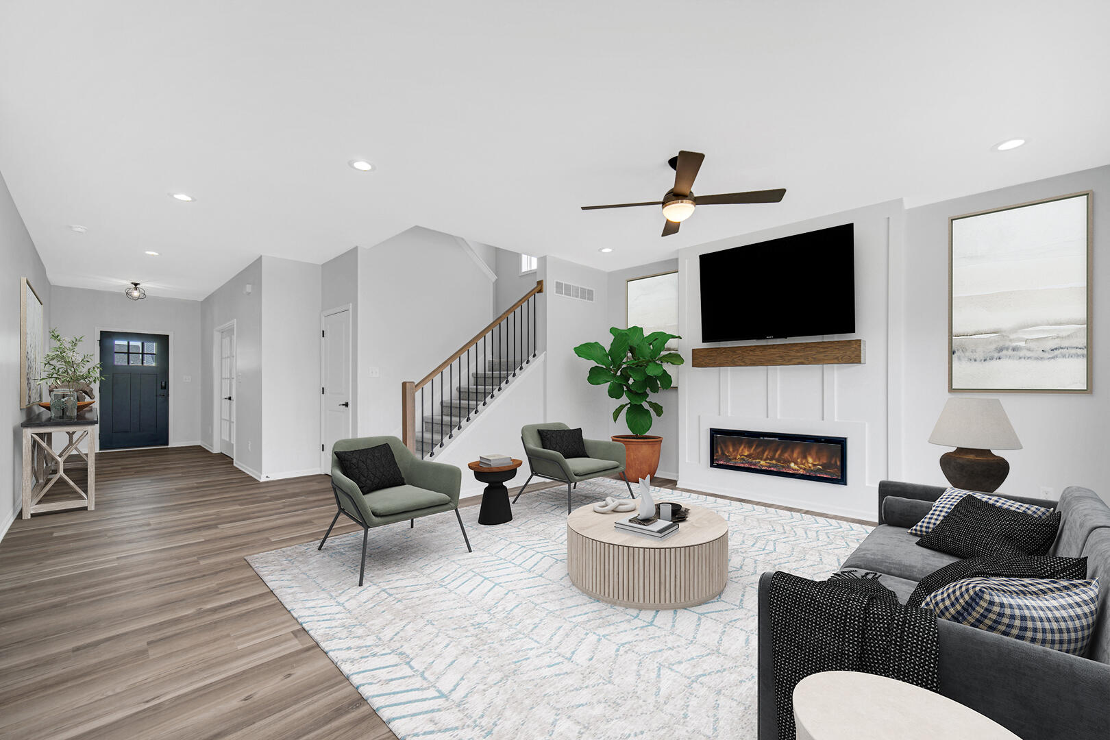 708 Druim Trail Crown Point, IN 46307 - Photo 3 of 27 a living room with furniture a fireplace and a flat screen tv