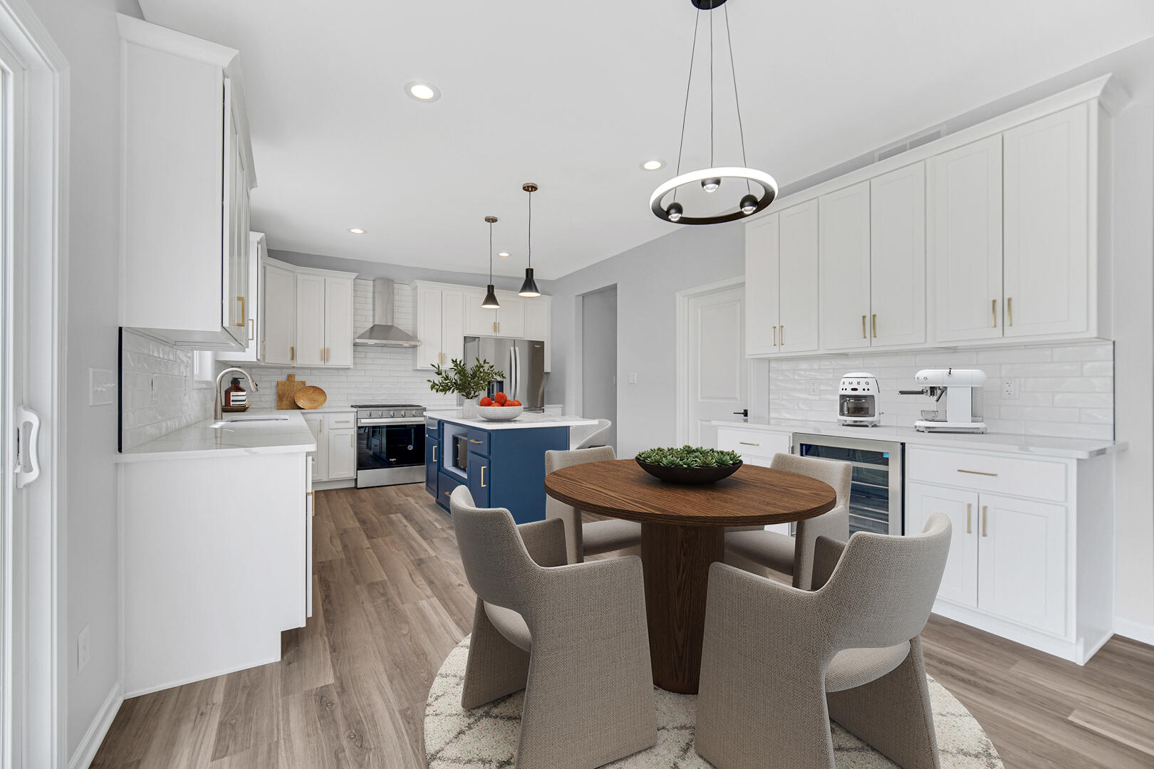 708 Druim Trail Crown Point, IN 46307 - Photo 6 of 27 a kitchen with stainless steel appliances granite countertop a dining table chairs stove and white cabinets