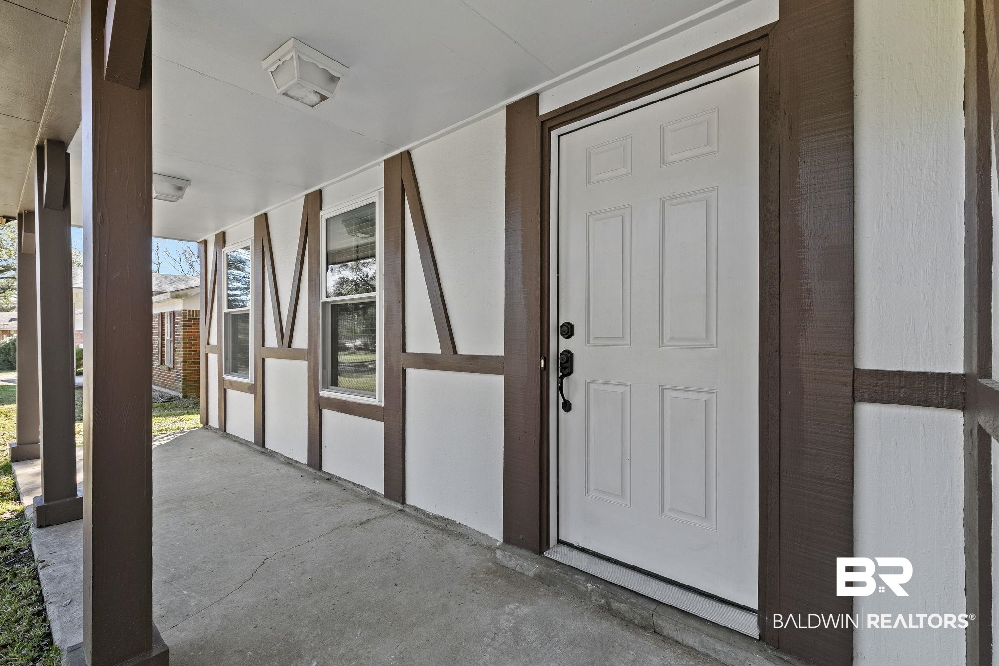 5817 Woodgate Road Mobile, AL 36609 - Photo 7 of 85 View of exterior entry featuring a porch