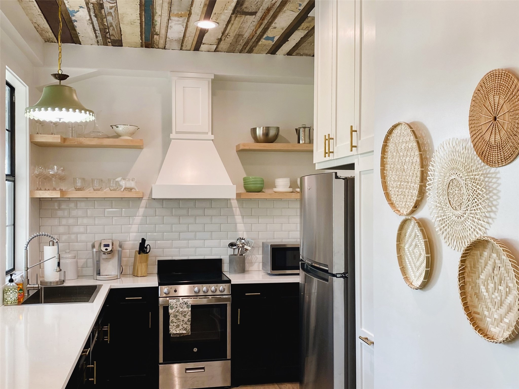6978 Skull Creek Road Fayetteville, TX 78940 - Photo 17 of 24 Beautiful "Bunkhouse" kitchen has all the extras including antique barn wood ceiling, chandeliers, custom cabinets and more.