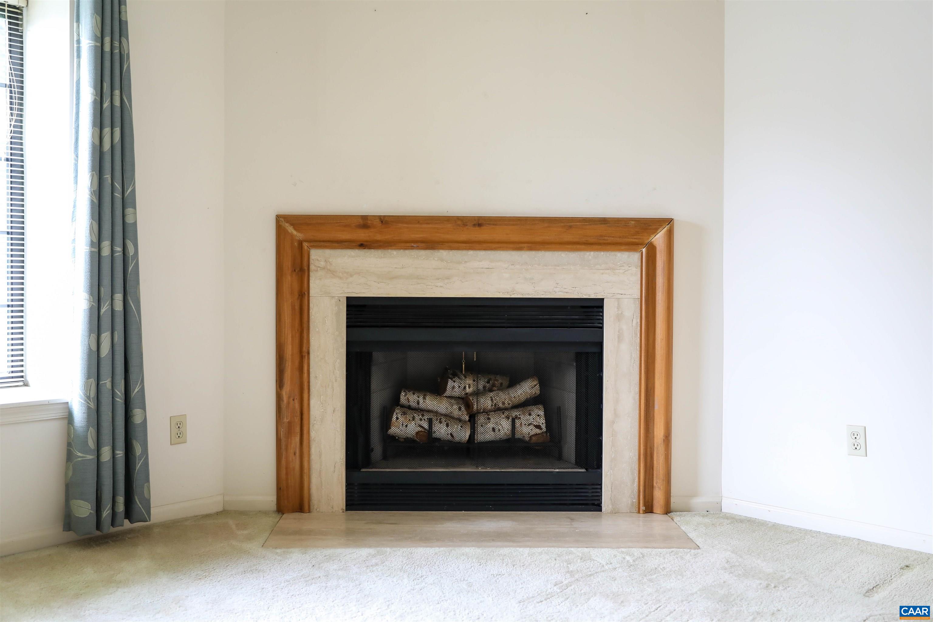 976 Amber Ridge Road Charlottesville, VA 22901 - Photo 4 of 8 a living room with a fireplace
