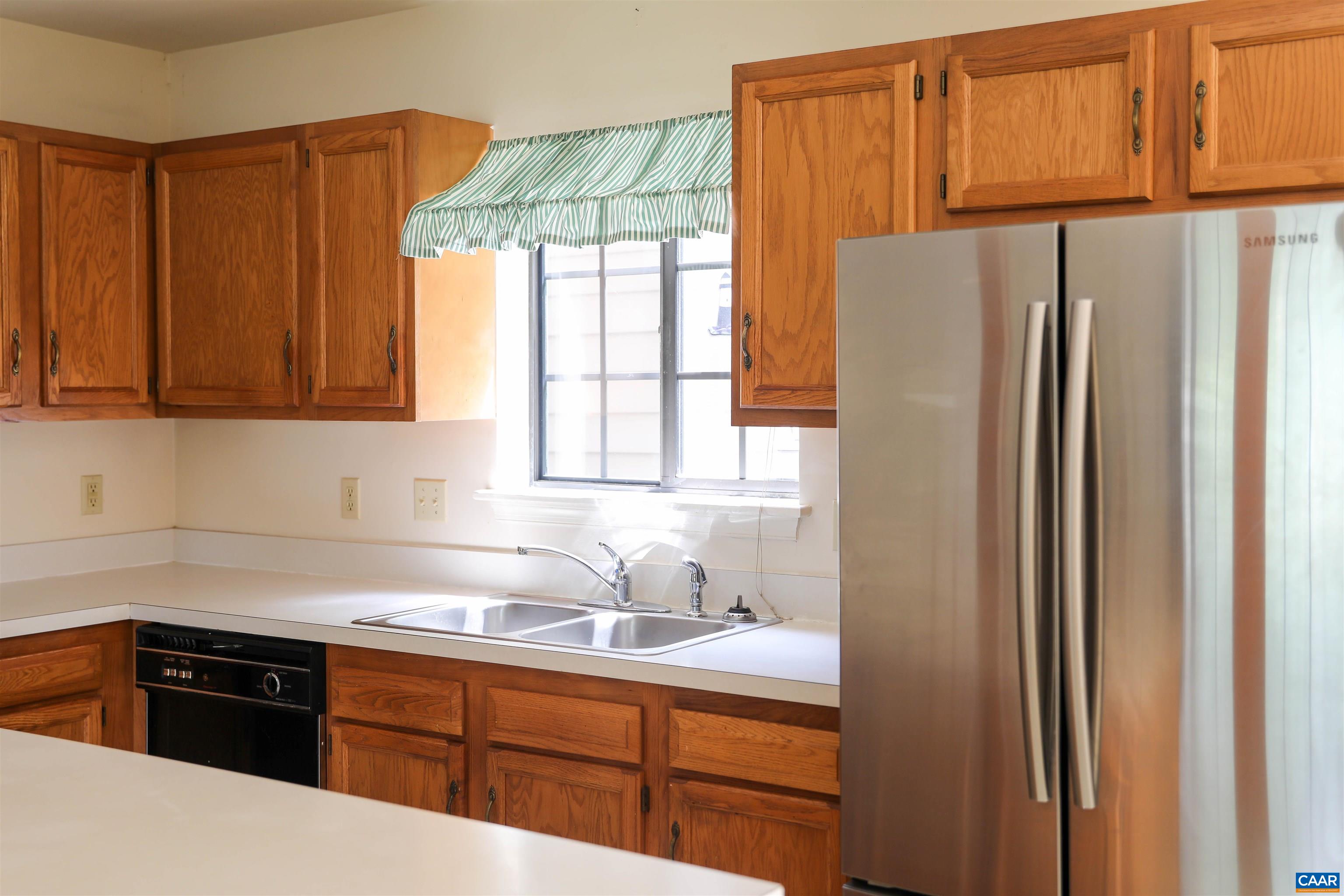 976 Amber Ridge Road Charlottesville, VA 22901 - Photo 6 of 8 a kitchen with stainless steel appliances granite countertop a refrigerator and a sink