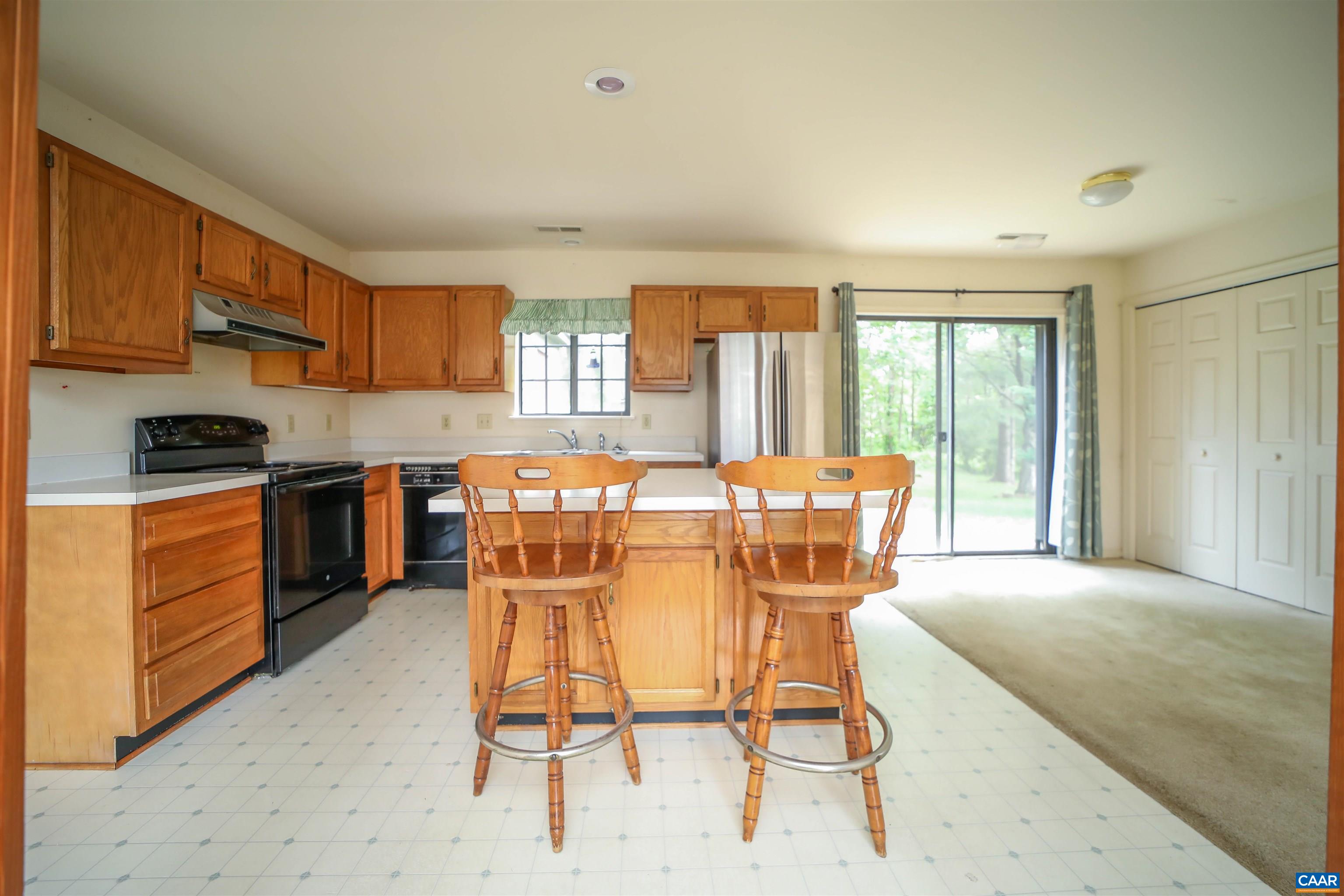 976 Amber Ridge Road Charlottesville, VA 22901 - Photo 7 of 8 a dining room with furniture and large windows