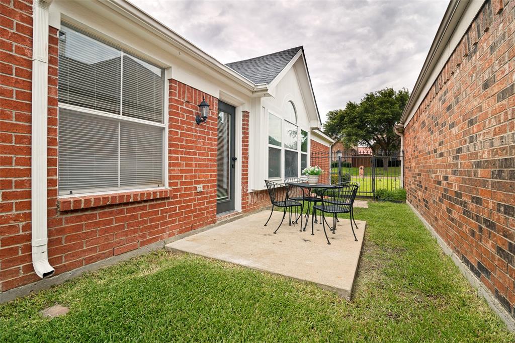 3020 Ridge Hollow Drive Plano, TX 75023 - Photo 27 of 28 Concrete patio area with brick exterior and white trim