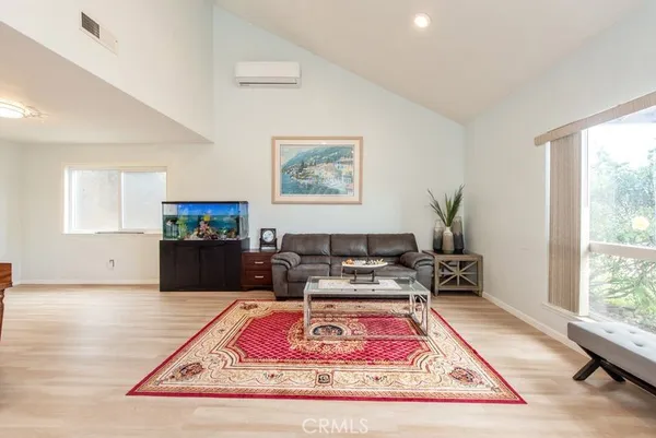 a living room with furniture and a rug