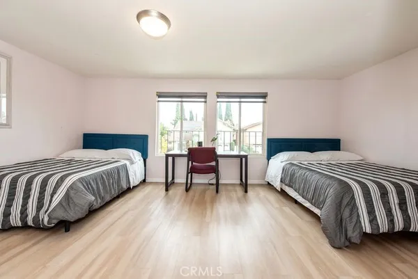 a bedroom with a bed and a chair
