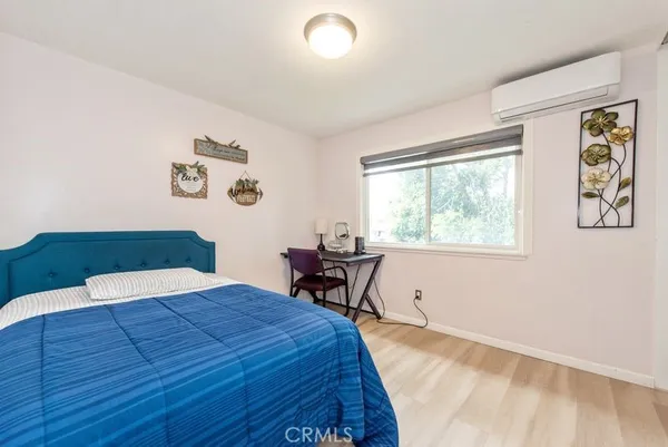 a bedroom with a bed and a table