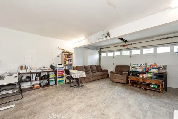 a living room with lots of furniture and a flat screen tv