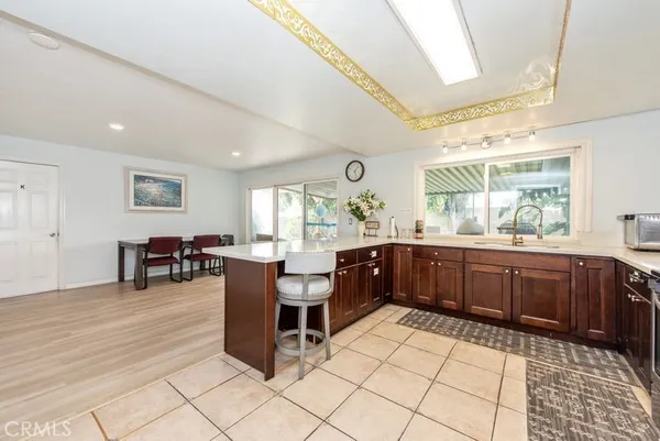 a kitchen with lots of counter top space and dining table