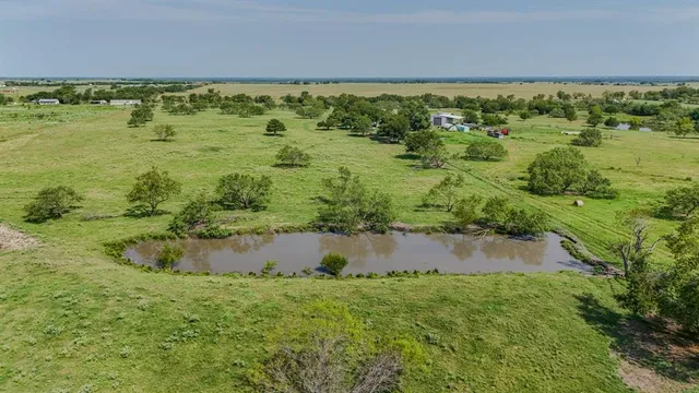 a view of a lake with a yard
