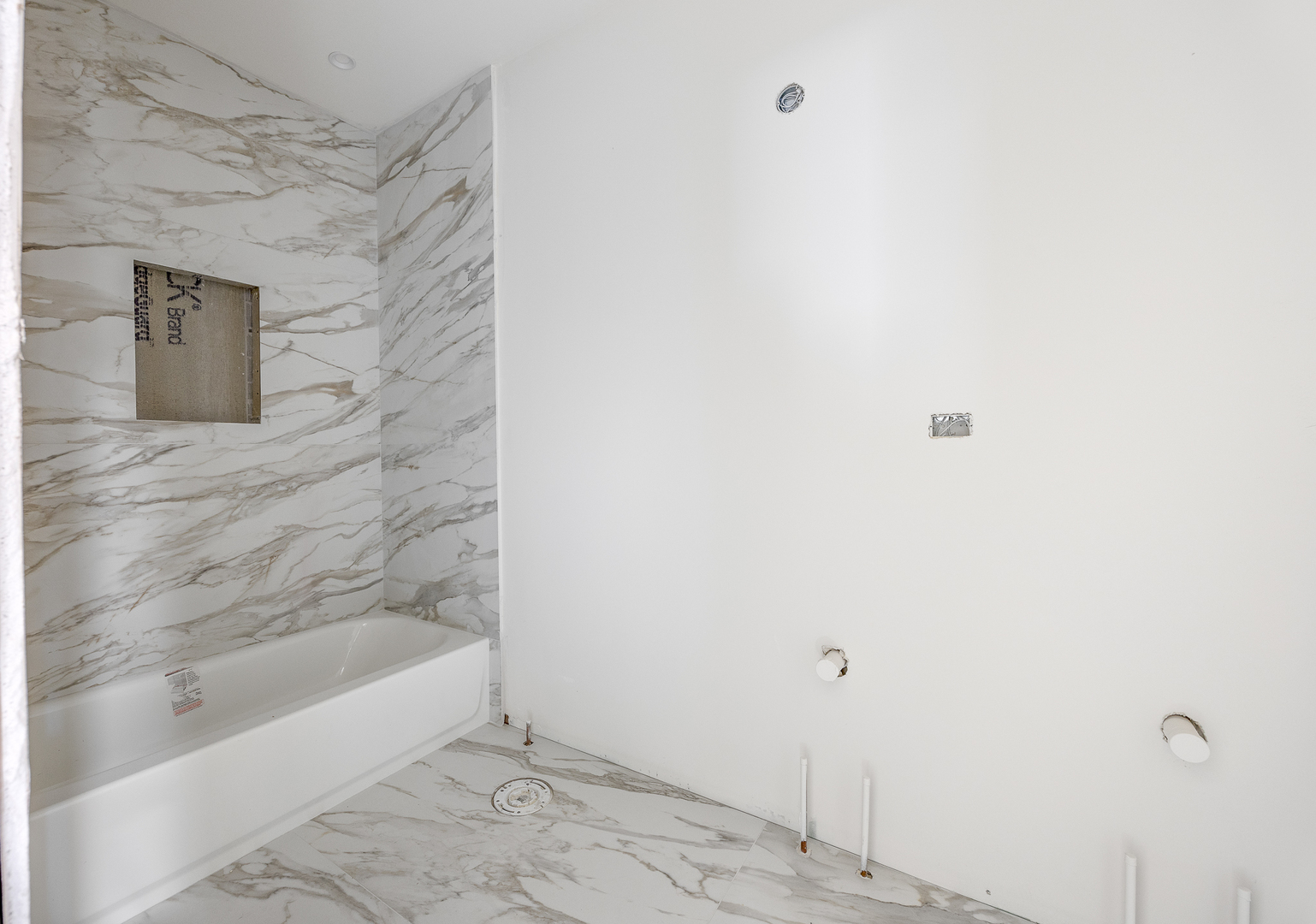 3408 South Carpenter Street Chicago, IL 60608 - Photo 4 of 16 a bathroom with a bathtub and shower