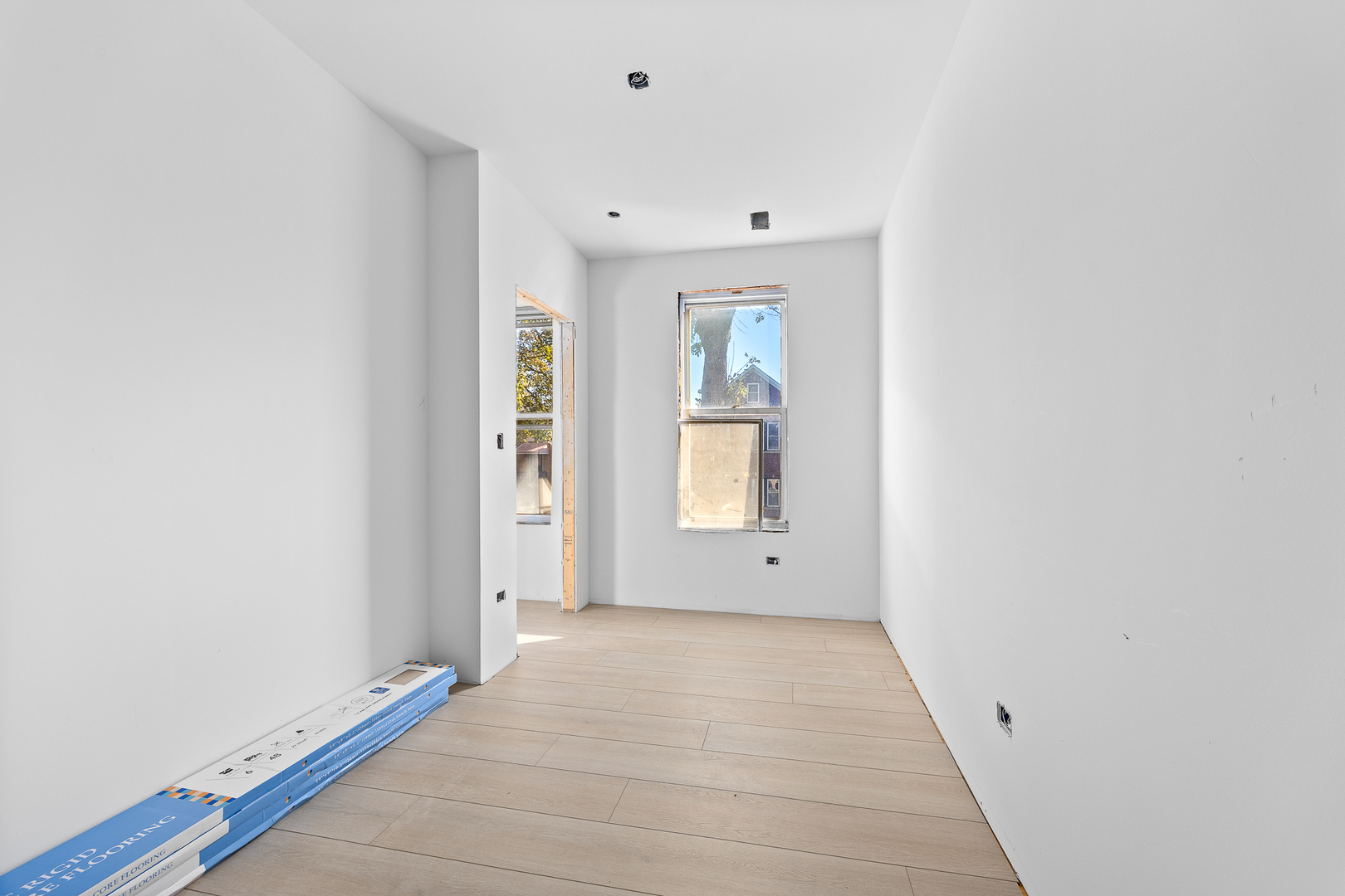 3408 South Carpenter Street Chicago, IL 60608 - Photo 8 of 16 a view of room with window and hardwood floor