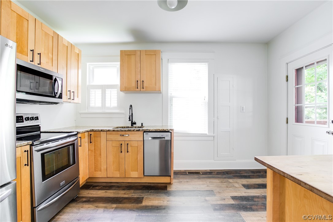 4604 Brook Road Richmond, VA 23227 - Photo 14 of 38 a kitchen with stainless steel appliances granite countertop a stove a sink and a microwave