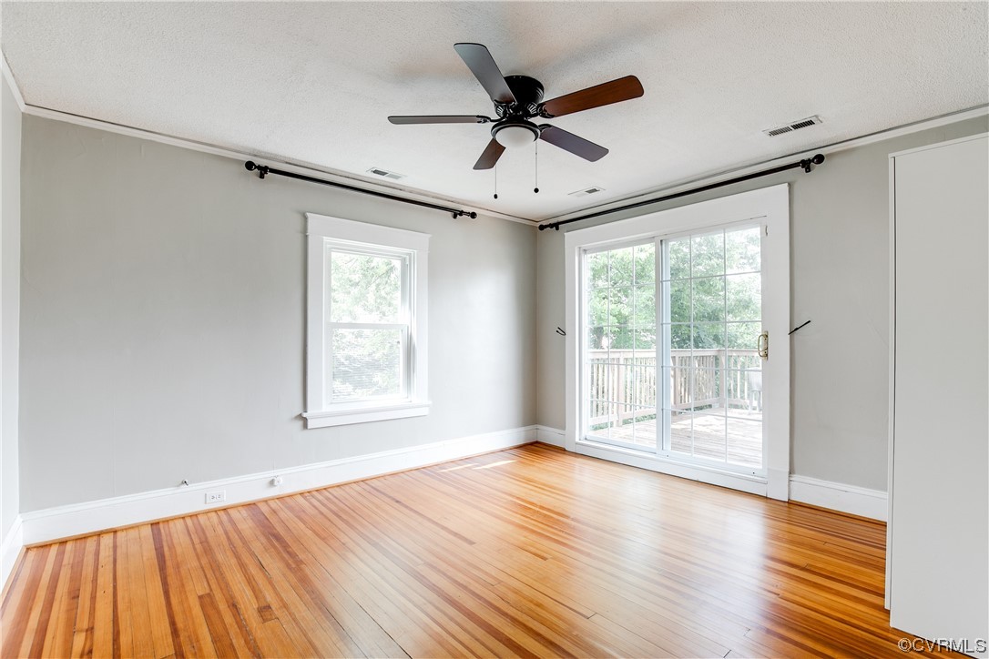 4604 Brook Road Richmond, VA 23227 - Photo 20 of 38 a view of an empty room with wooden floor and a window