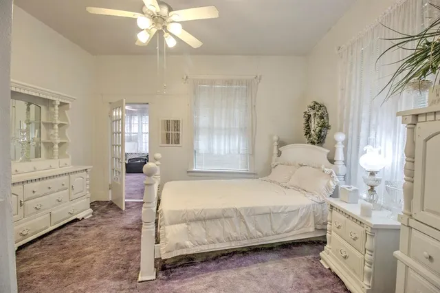 a bedroom with a bed and a cabinets