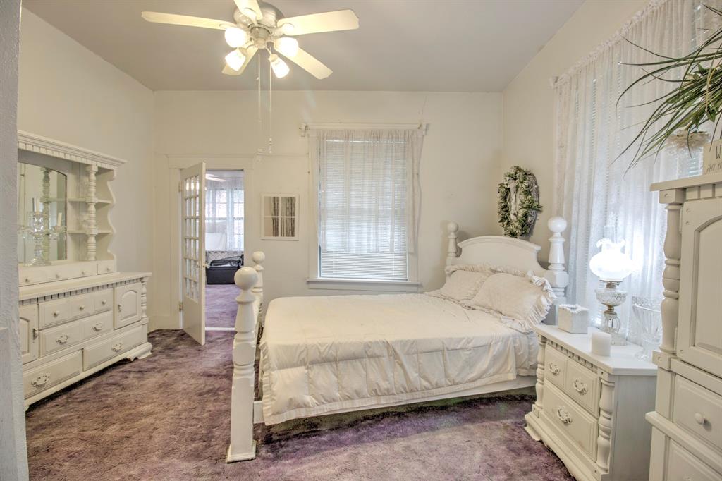 101 East Reed Trenton, TX 75490 - Photo 15 of 27 a bedroom with a bed and a cabinets