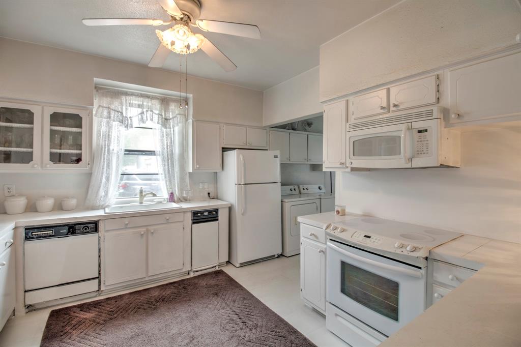101 East Reed Trenton, TX 75490 - Photo 17 of 27 a kitchen with white cabinets and white appliances