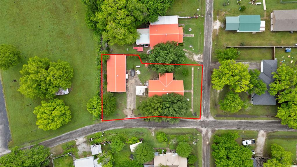 101 East Reed Trenton, TX 75490 - Photo 2 of 27 an aerial view of houses with yard