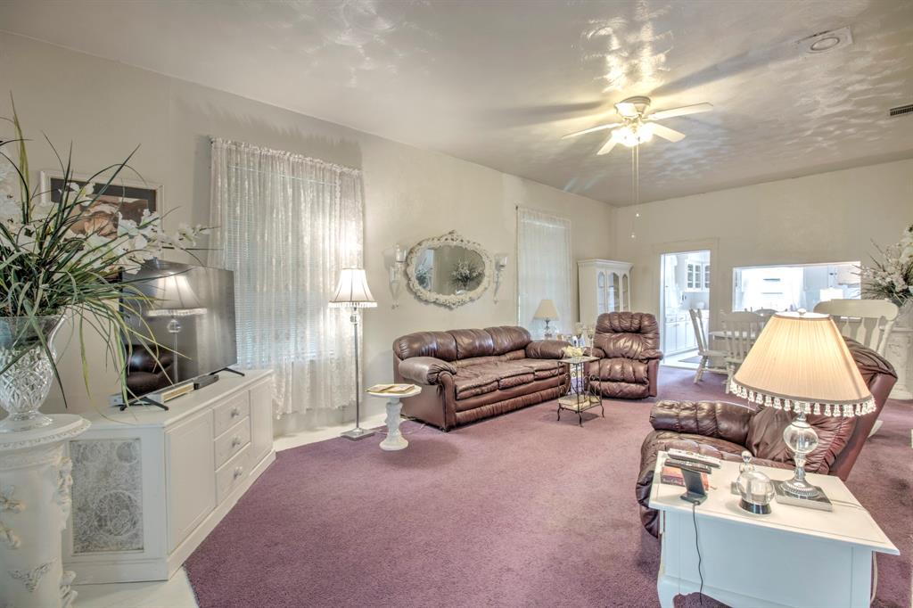 101 East Reed Trenton, TX 75490 - Photo 6 of 27 a living room with furniture and a chandelier