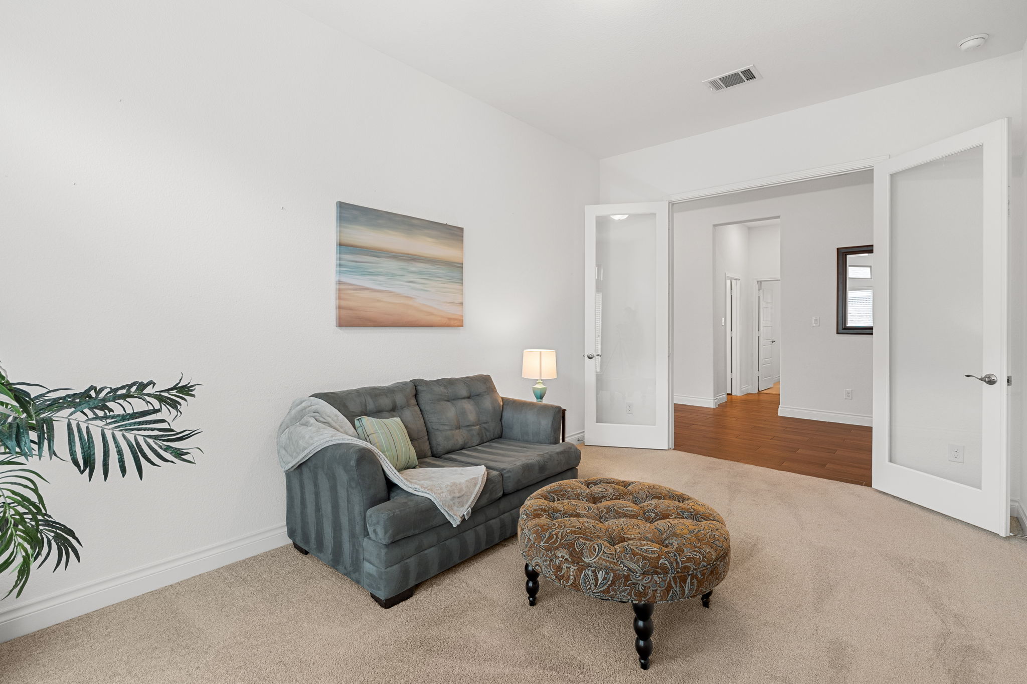 1908 Woolsey Way Leander, TX 78641 - Photo 14 of 36 French doors open into this versatile carpeted study, a perfect work-from-home sanctuary.