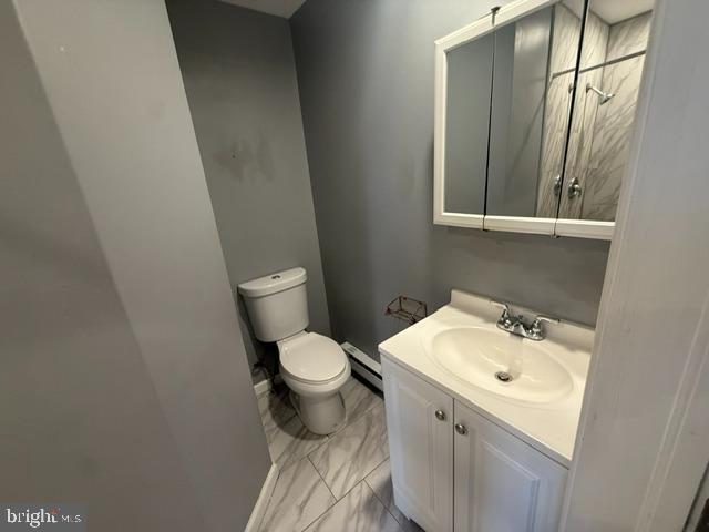 1224 Tasker Street, Unit 1R Philadelphia, PA 19148 - Photo 9 of 9 a bathroom with a sink and a toilet