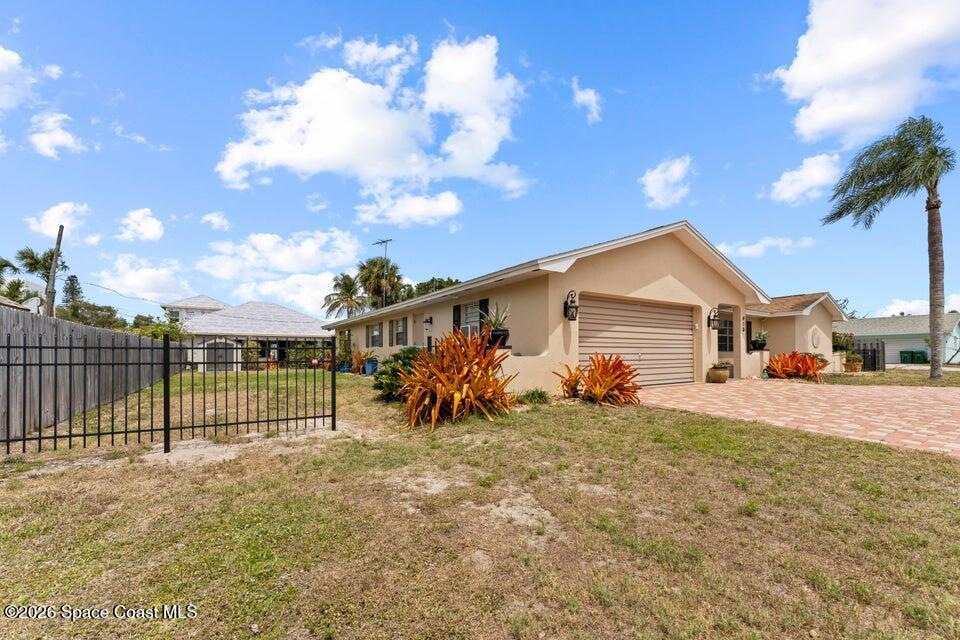 410 Surf Road Melbourne Beach, FL 32951 - Photo 29 of 29 a view of a house with a yard