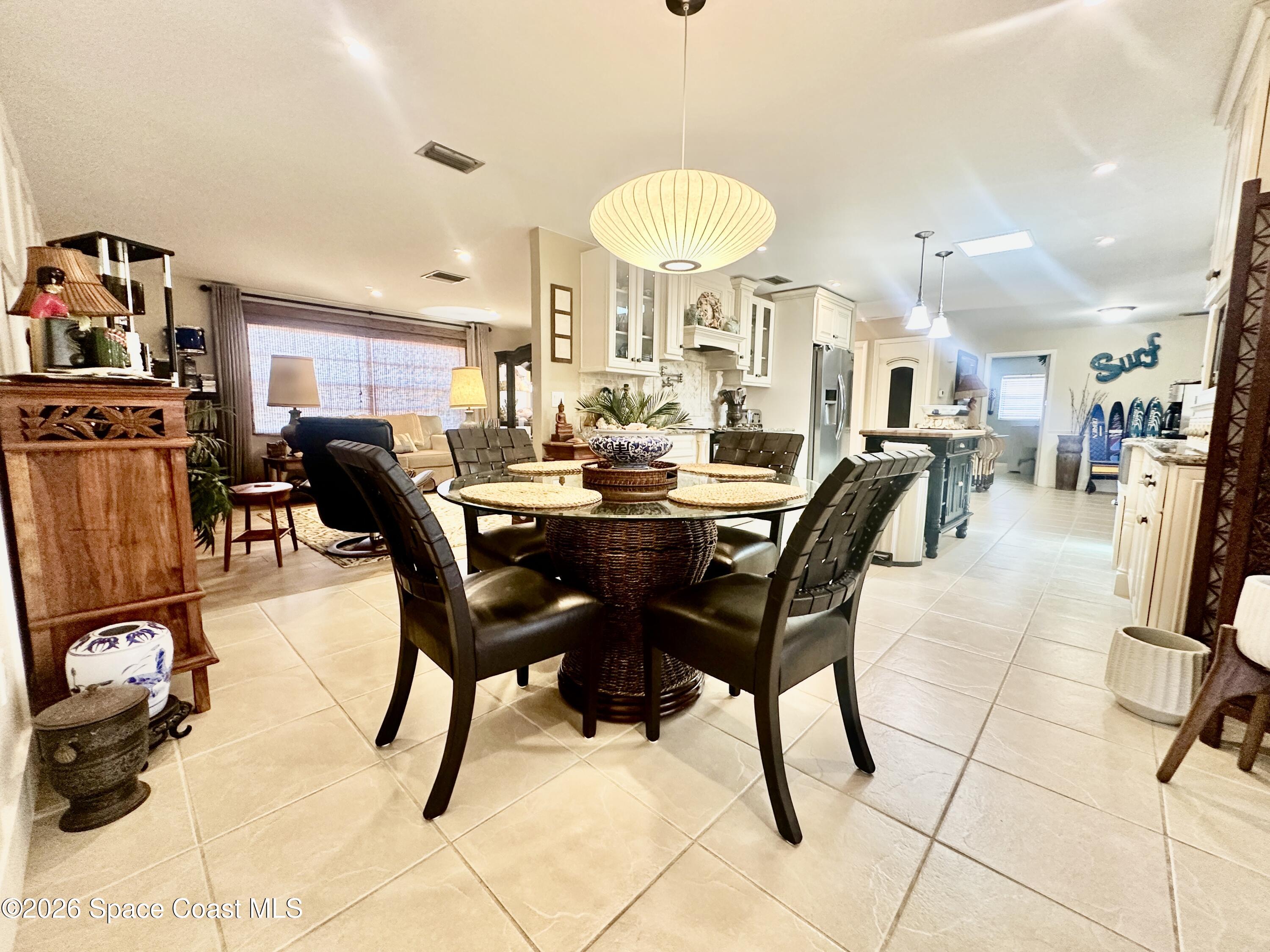 410 Surf Road Melbourne Beach, FL 32951 - Photo 6 of 29 a view of a dining room with furniture
