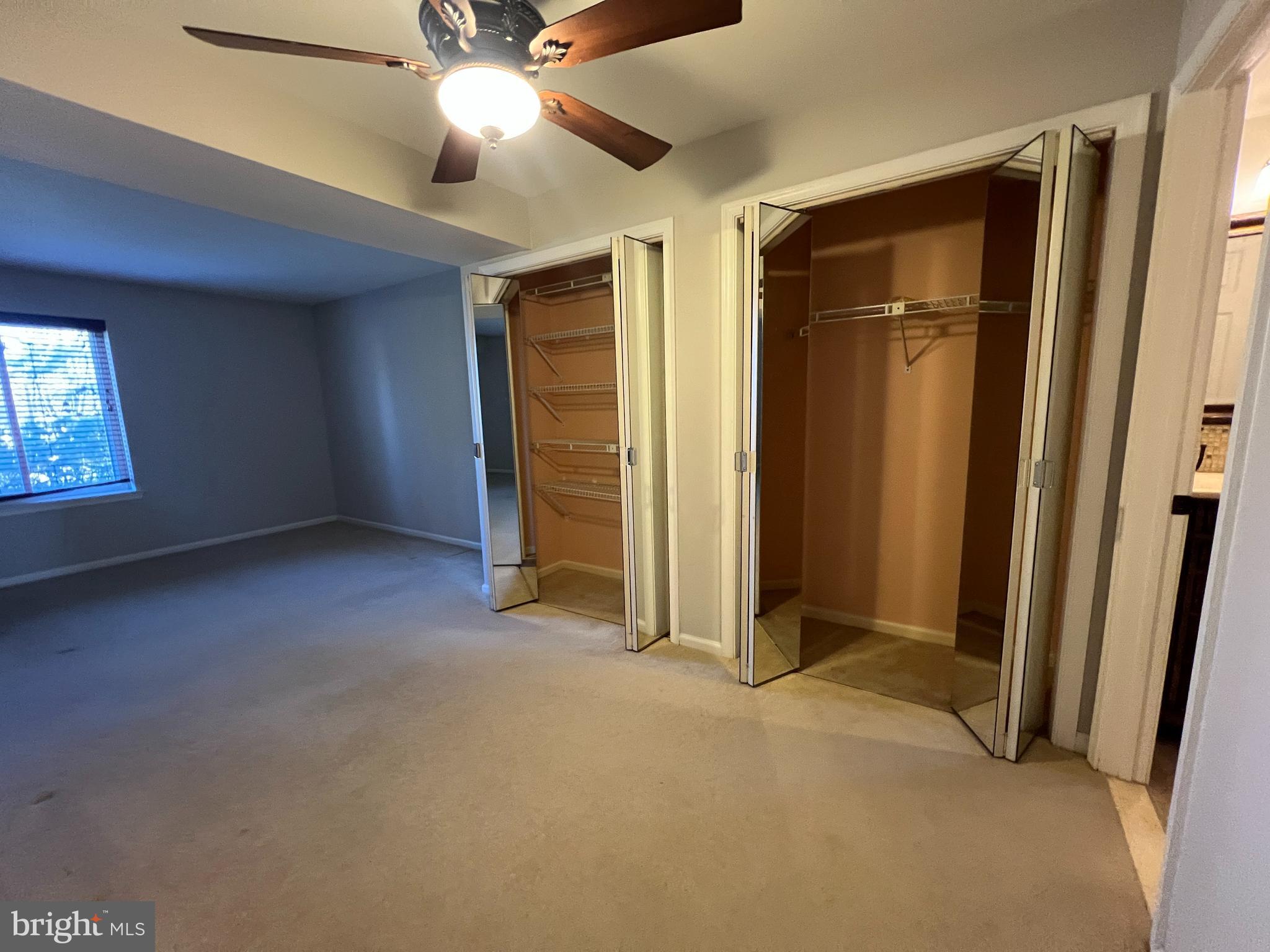 1701 Mountainview Drive, Unit 1701 Chesterbrook, PA 19087 - Photo 14 of 16 an empty room with closet and a ceiling fan