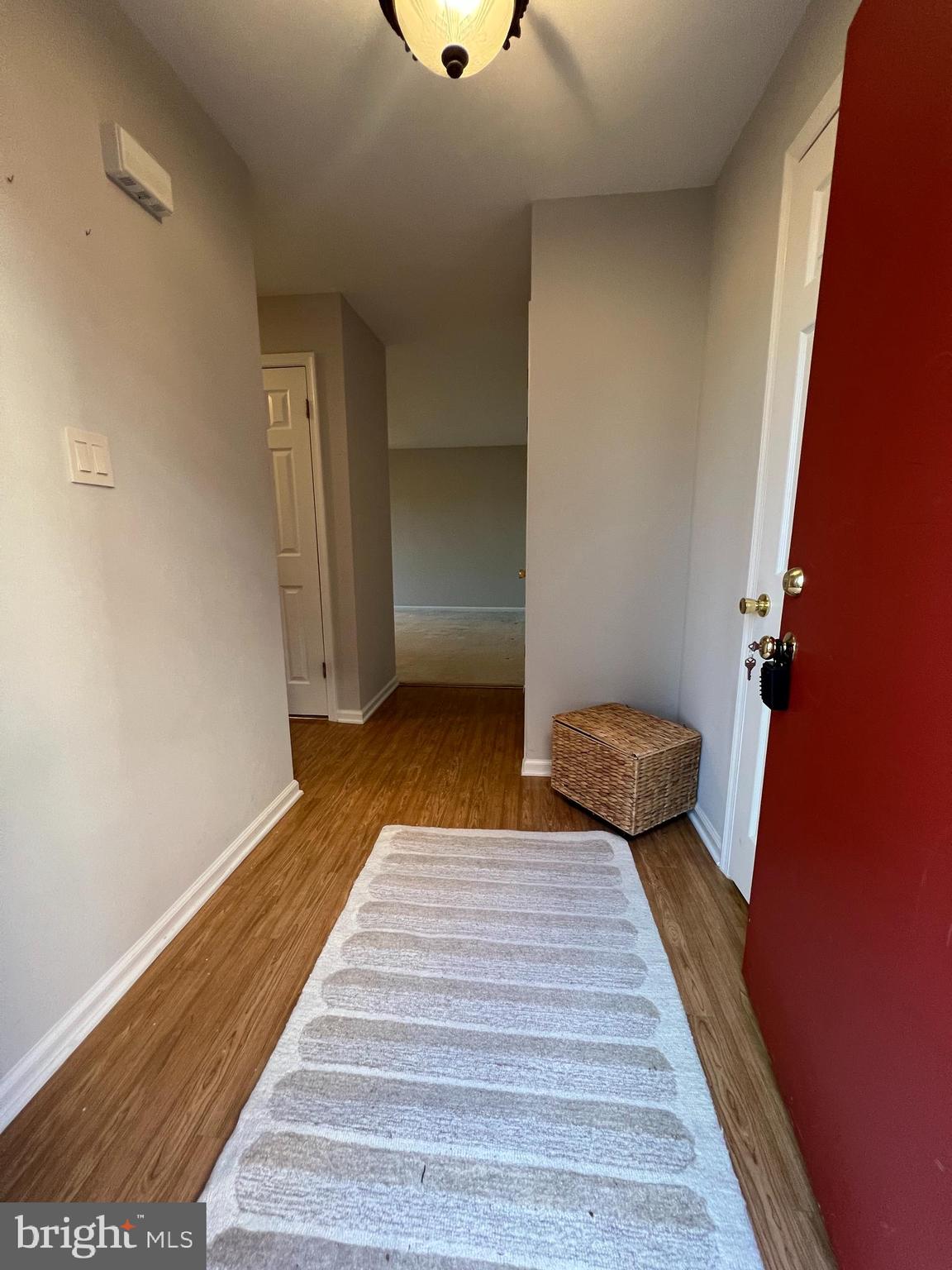 1701 Mountainview Drive, Unit 1701 Chesterbrook, PA 19087 - Photo 5 of 16 a bedroom with wooden floor and fan