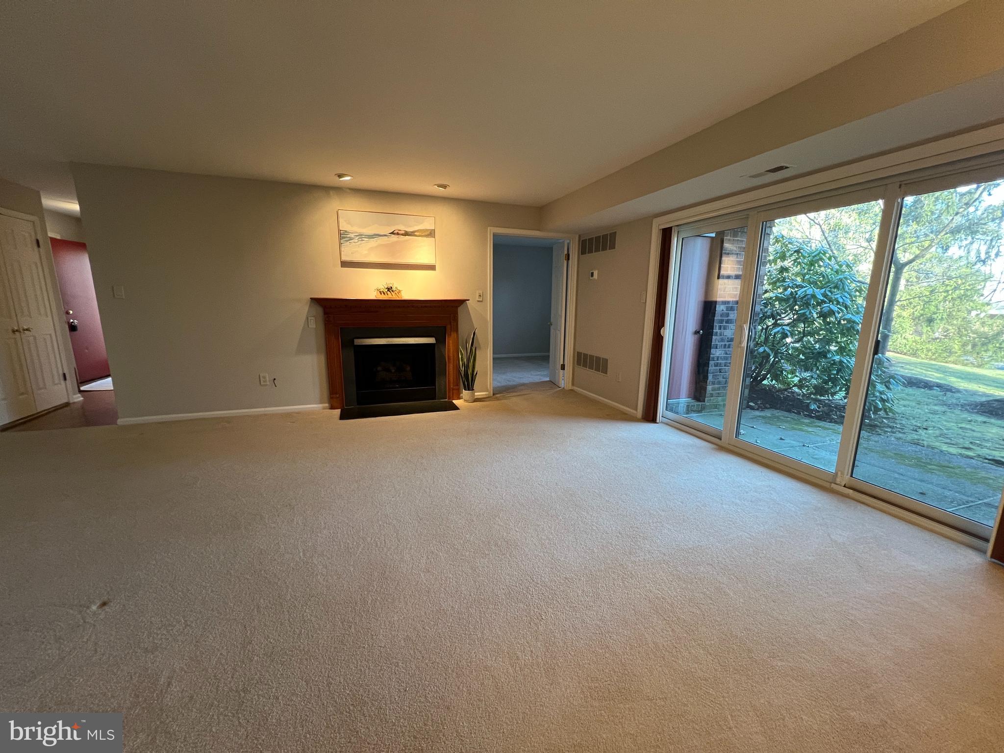 1701 Mountainview Drive, Unit 1701 Chesterbrook, PA 19087 - Photo 6 of 16 an empty room with furniture and a floor to ceiling window