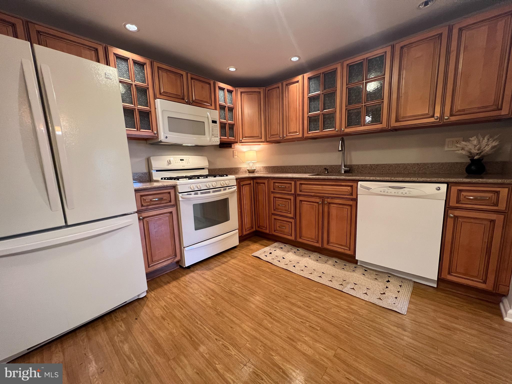 1701 Mountainview Drive, Unit 1701 Chesterbrook, PA 19087 - Photo 7 of 16 a kitchen with stainless steel appliances granite countertop a refrigerator sink and cabinets