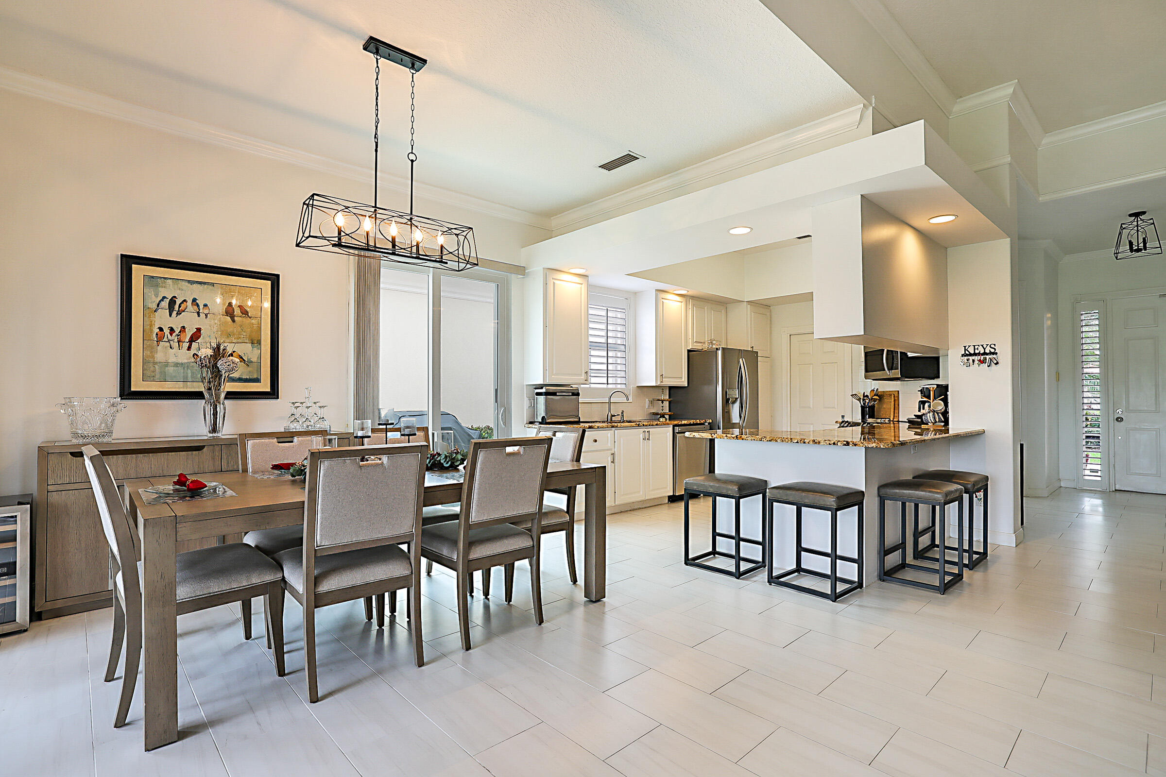 9520 Southwest Wedgewood Lane Stuart, FL 34997 - Photo 11 of 53 a view of a dining room with furniture