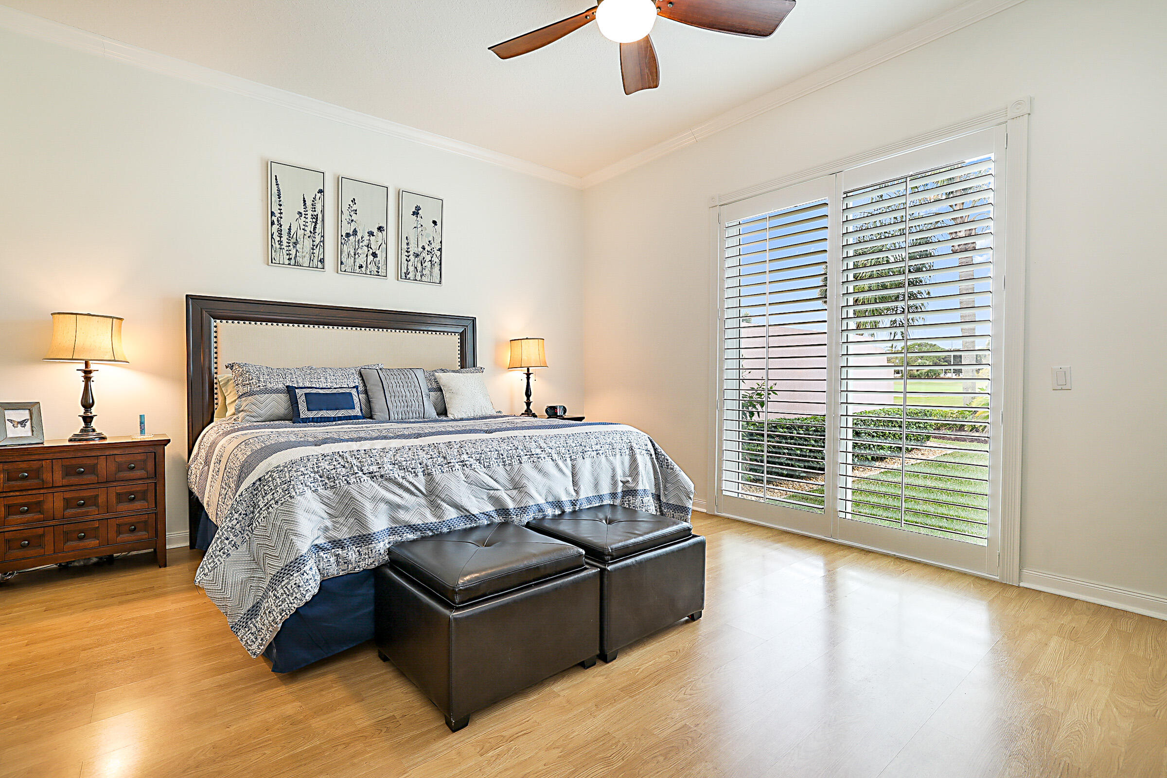 9520 Southwest Wedgewood Lane Stuart, FL 34997 - Photo 21 of 53 a bed sitting in a bedroom next to a window