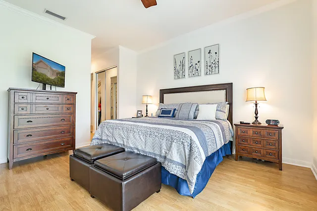 a bedroom with a bed and dresser