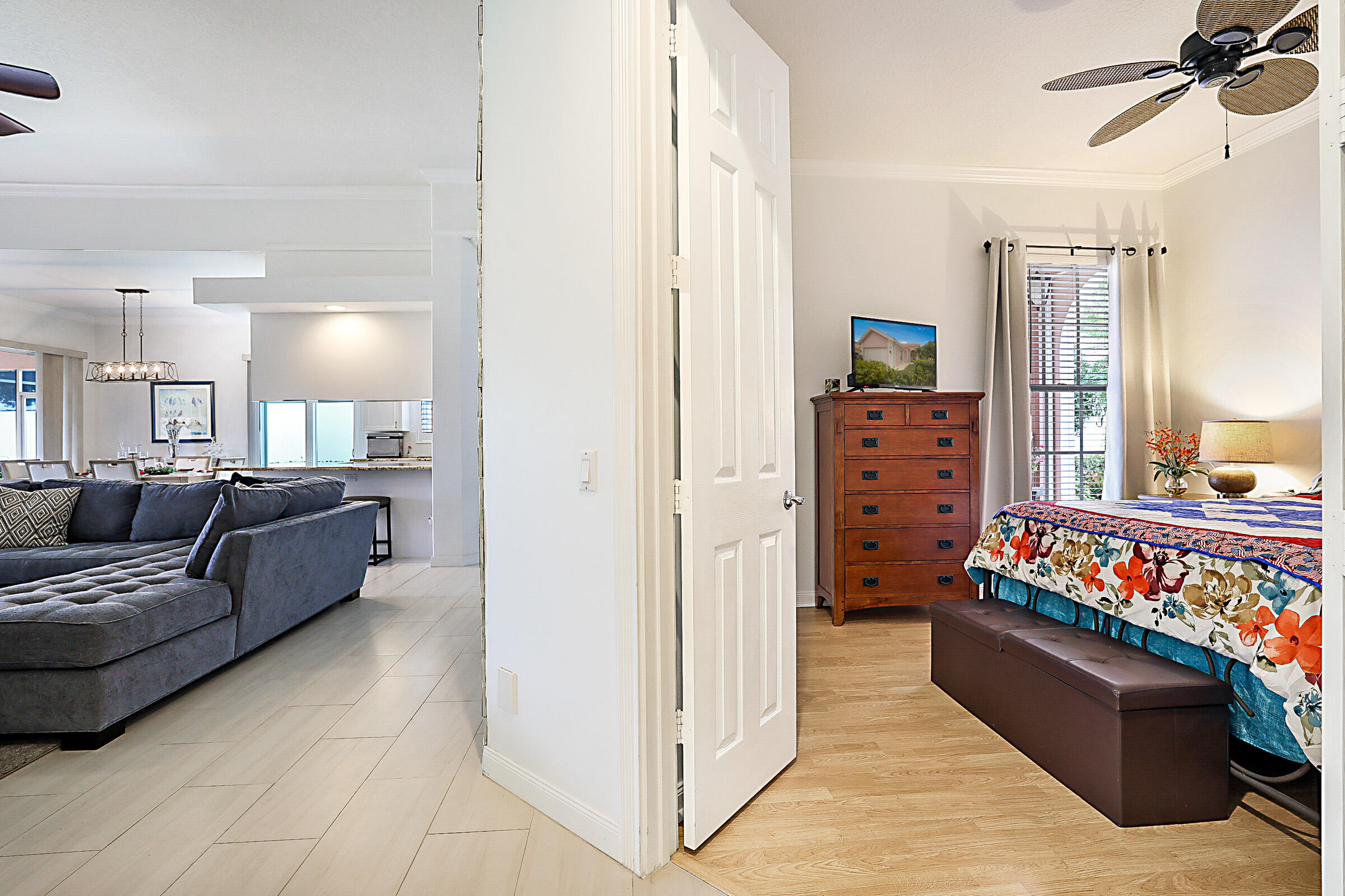 9520 Southwest Wedgewood Lane Stuart, FL 34997 - Photo 30 of 53 a living room with furniture and a baby crib