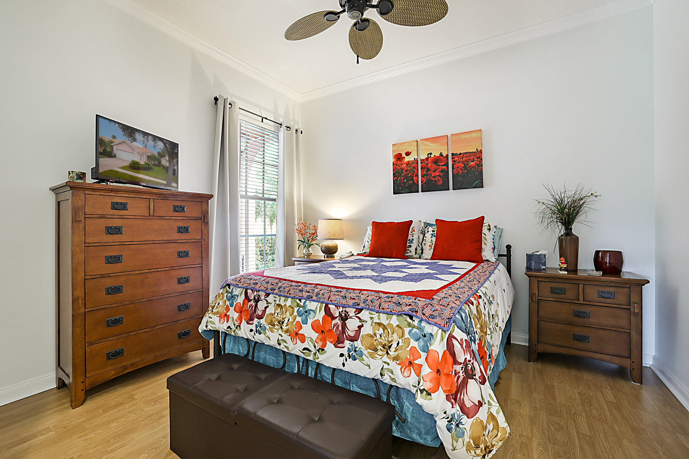 9520 Southwest Wedgewood Lane Stuart, FL 34997 - Photo 31 of 53 a bedroom with a bed and furniture