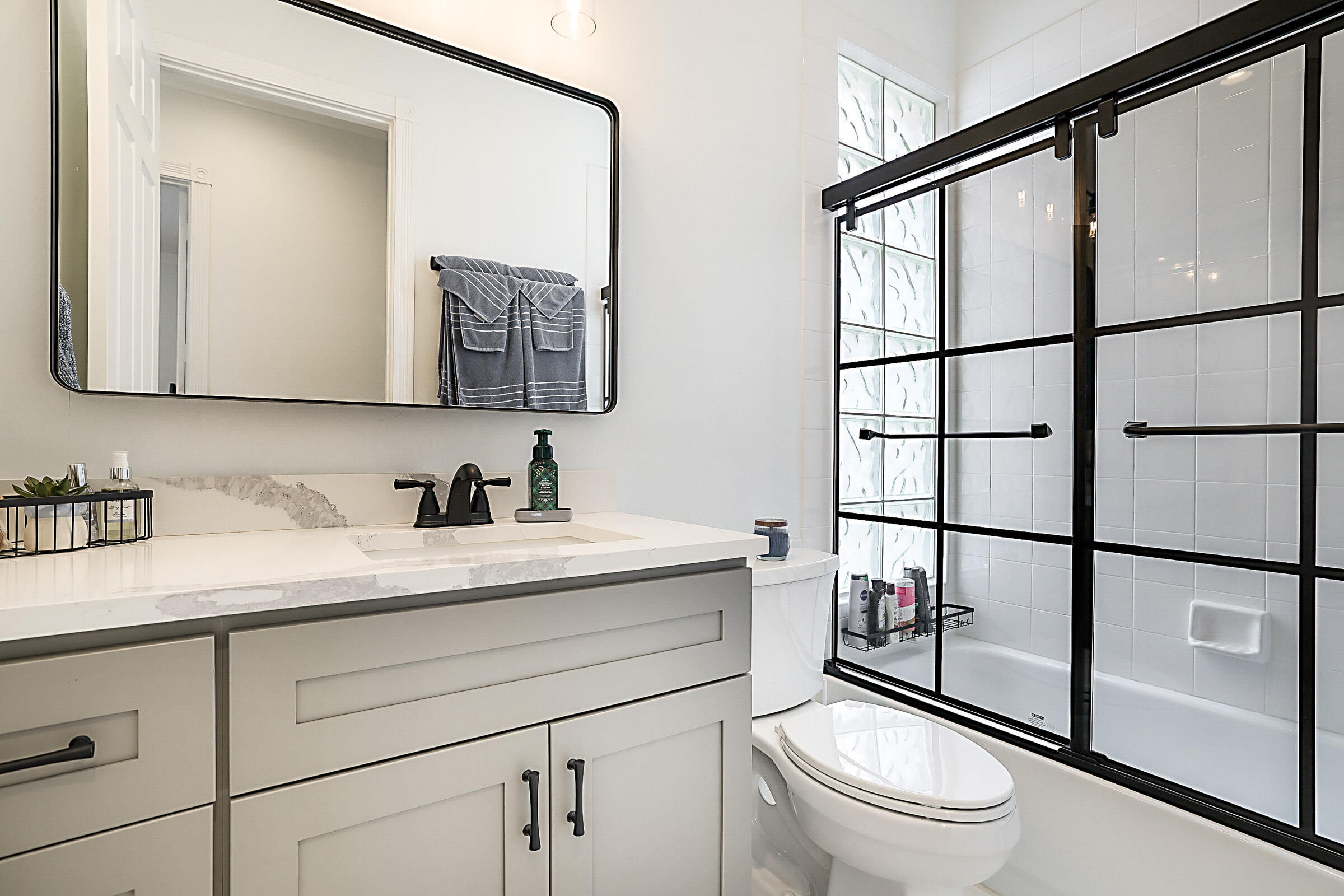 9520 Southwest Wedgewood Lane Stuart, FL 34997 - Photo 32 of 53 a bathroom with a granite countertop sink mirror vanity and toilet