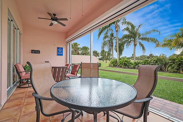 a view of a balcony with furniture