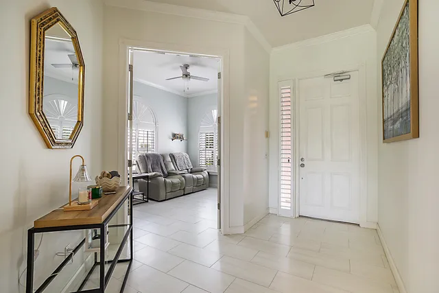 a view of a livingroom with furniture and a mirror