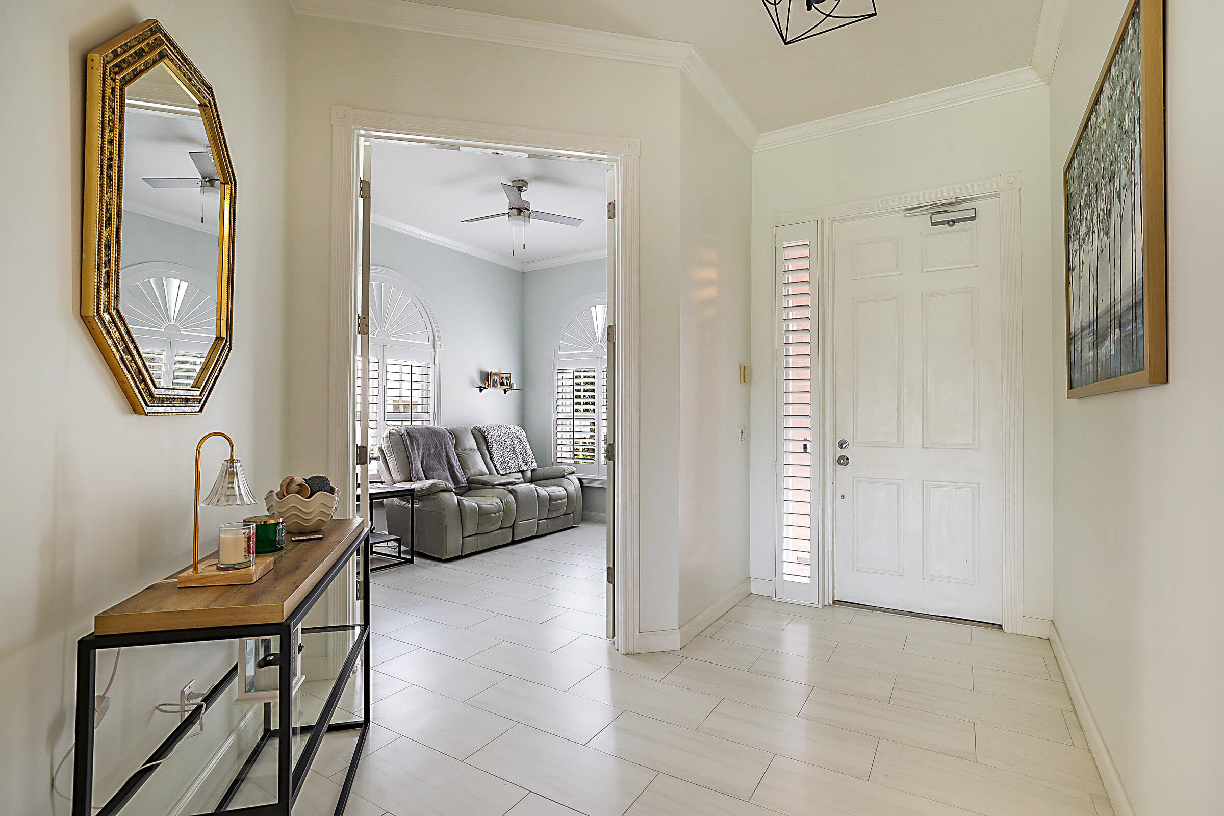 9520 Southwest Wedgewood Lane Stuart, FL 34997 - Photo 4 of 53 a view of a livingroom with furniture and a mirror