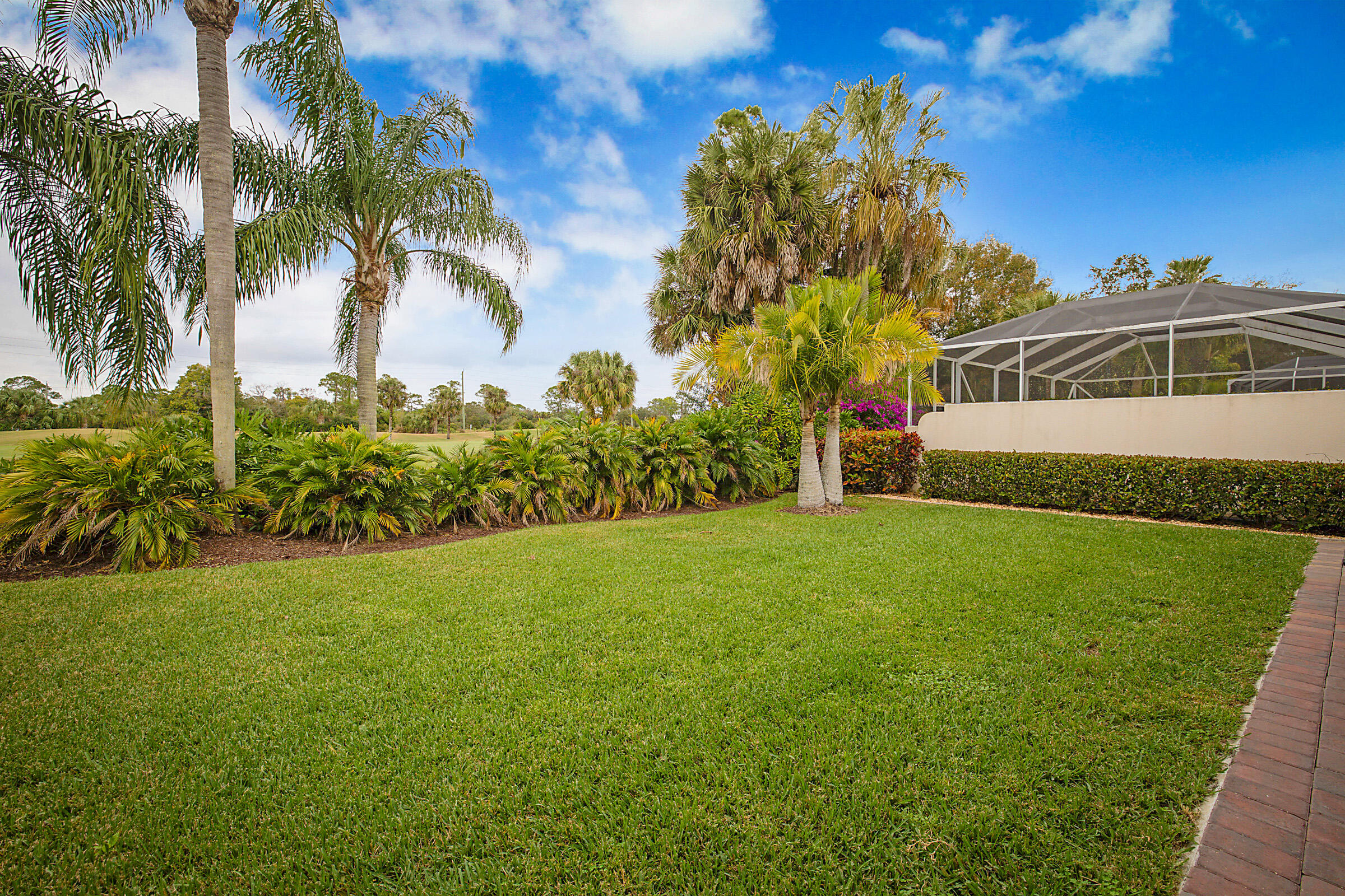 9520 Southwest Wedgewood Lane Stuart, FL 34997 - Photo 42 of 53 a view of a house with a yard